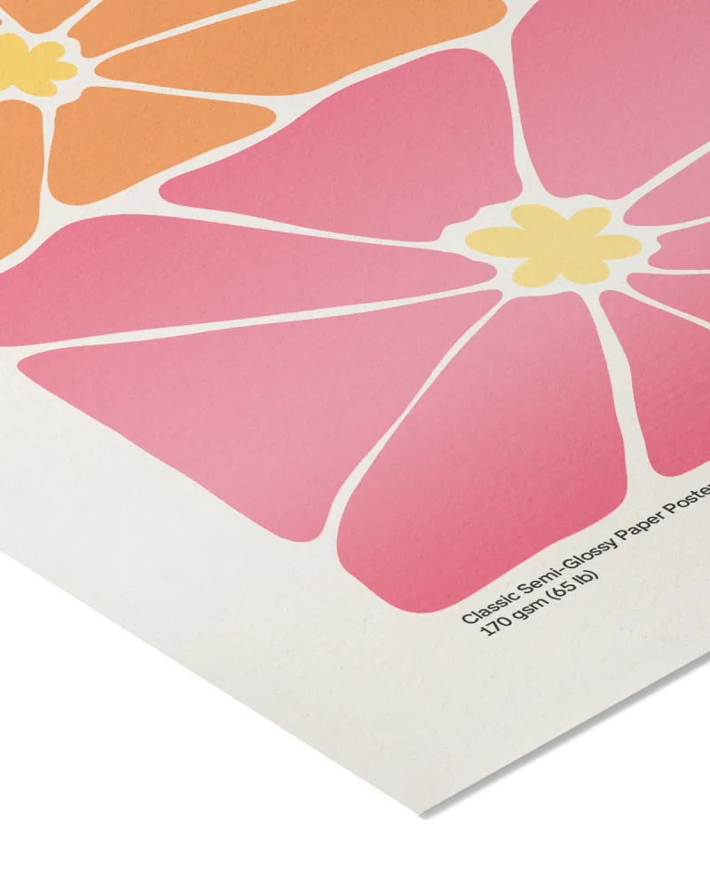 Close-up of a pink floral design on a paper poster with text.