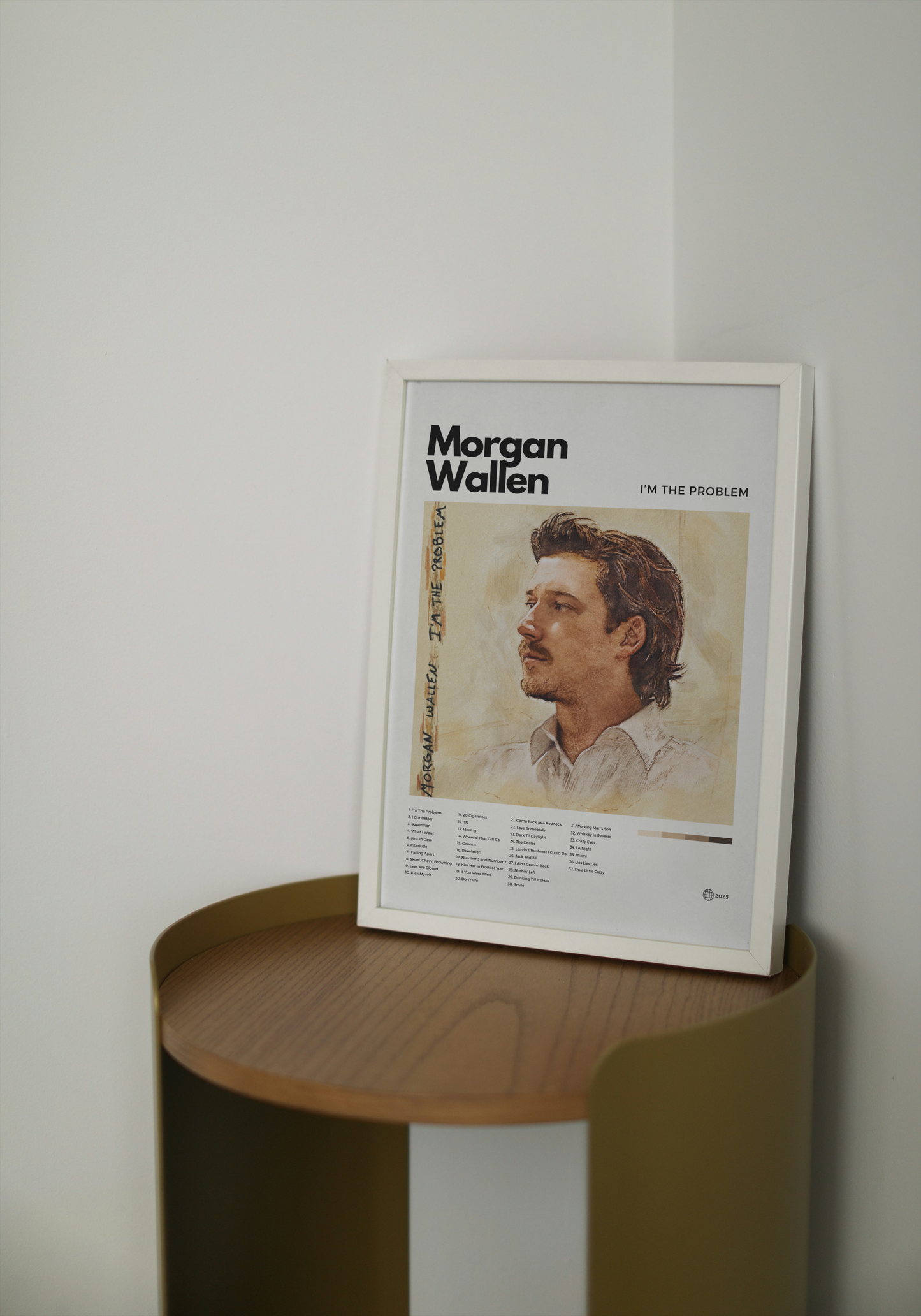 Framed poster of a person on a wooden shelf against a white wall