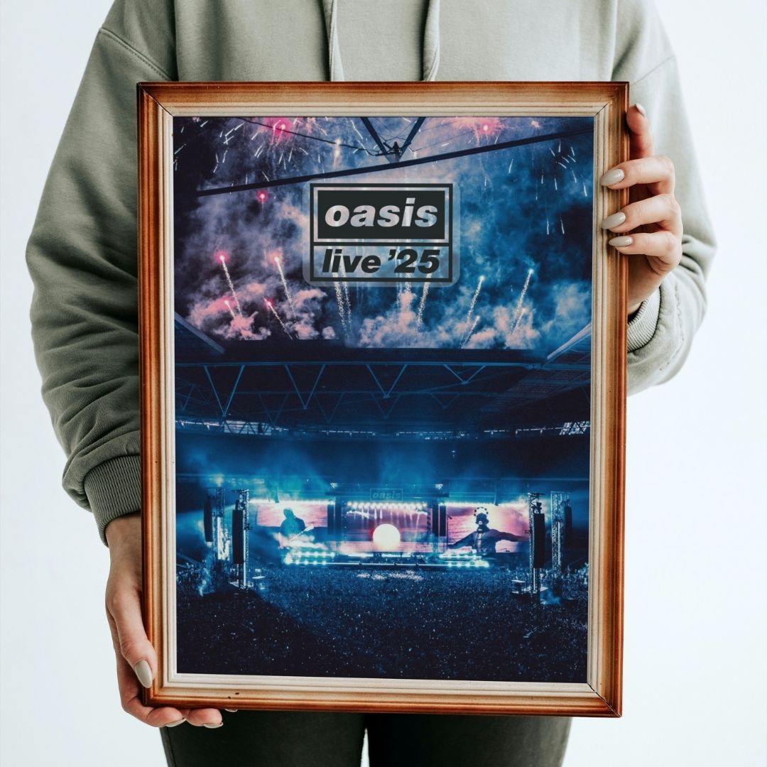 Person holding a framed concert poster for 'oasis live '25' with a blue and purple color scheme.
