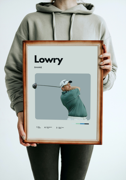 Person holding a framed picture of a golfer with 'Lowry' and 'Shane' text.