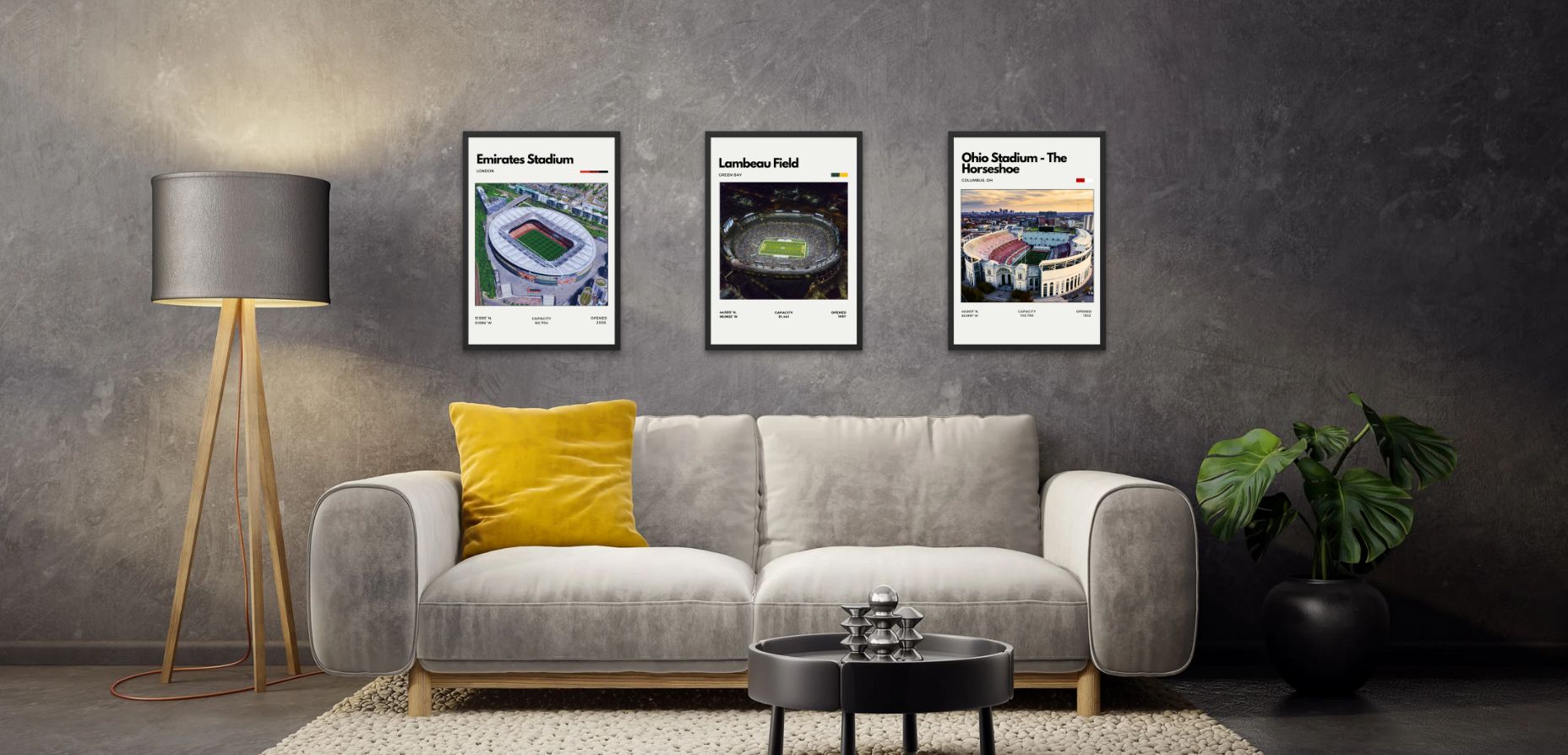 Gray sofa with yellow pillow, lamp, and framed sports posters on a gray wall