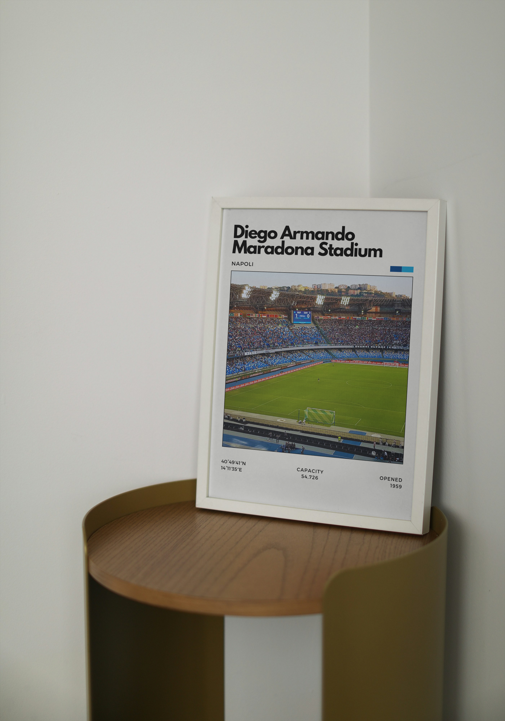 Poster of Diego Armando Maradona Stadium in Naples, Italy, showing a full crowd with blue seating and green pitch under bright stadium lights.