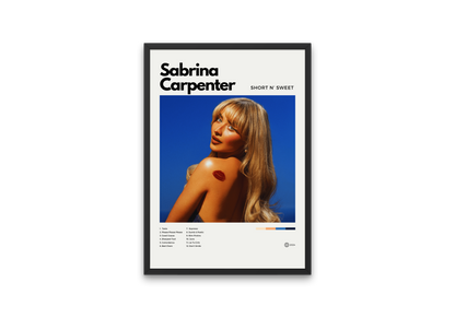 Framed poster of Sabrina Carpenter with a blue background and text.